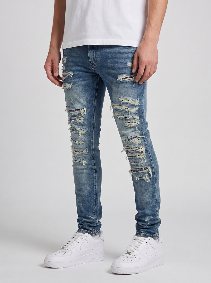 Jeans ajustados de mezclilla azul medio desgastados Belvedere