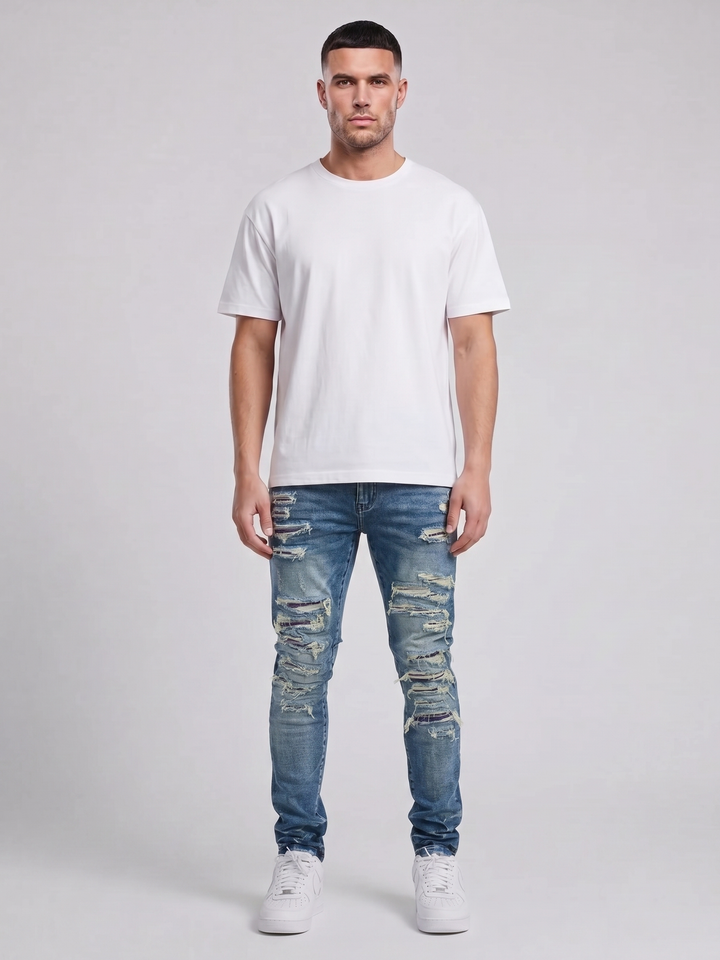 Jeans ajustados de mezclilla azul medio desgastados Belvedere